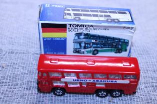 A boxed Tomica F37 die-cast model