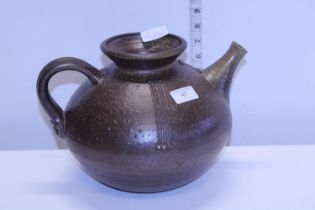 A large earthenware teapot