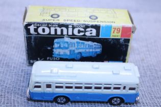 A boxed Tomica die-cast model 79