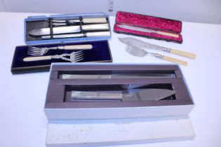 A selection of assorted boxed flatware etc