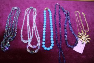 A job lot of assorted costume jewellery including natural stone examples and an Ann Klien vintage