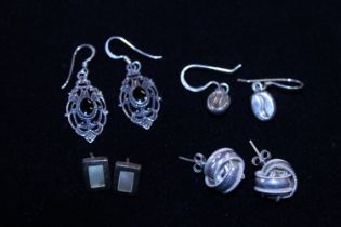 A selection of silver earrings