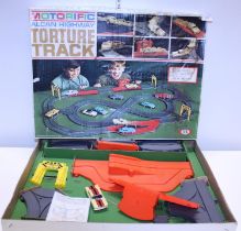 A boxed Ideal Motorific Alcan Highway Torture Track