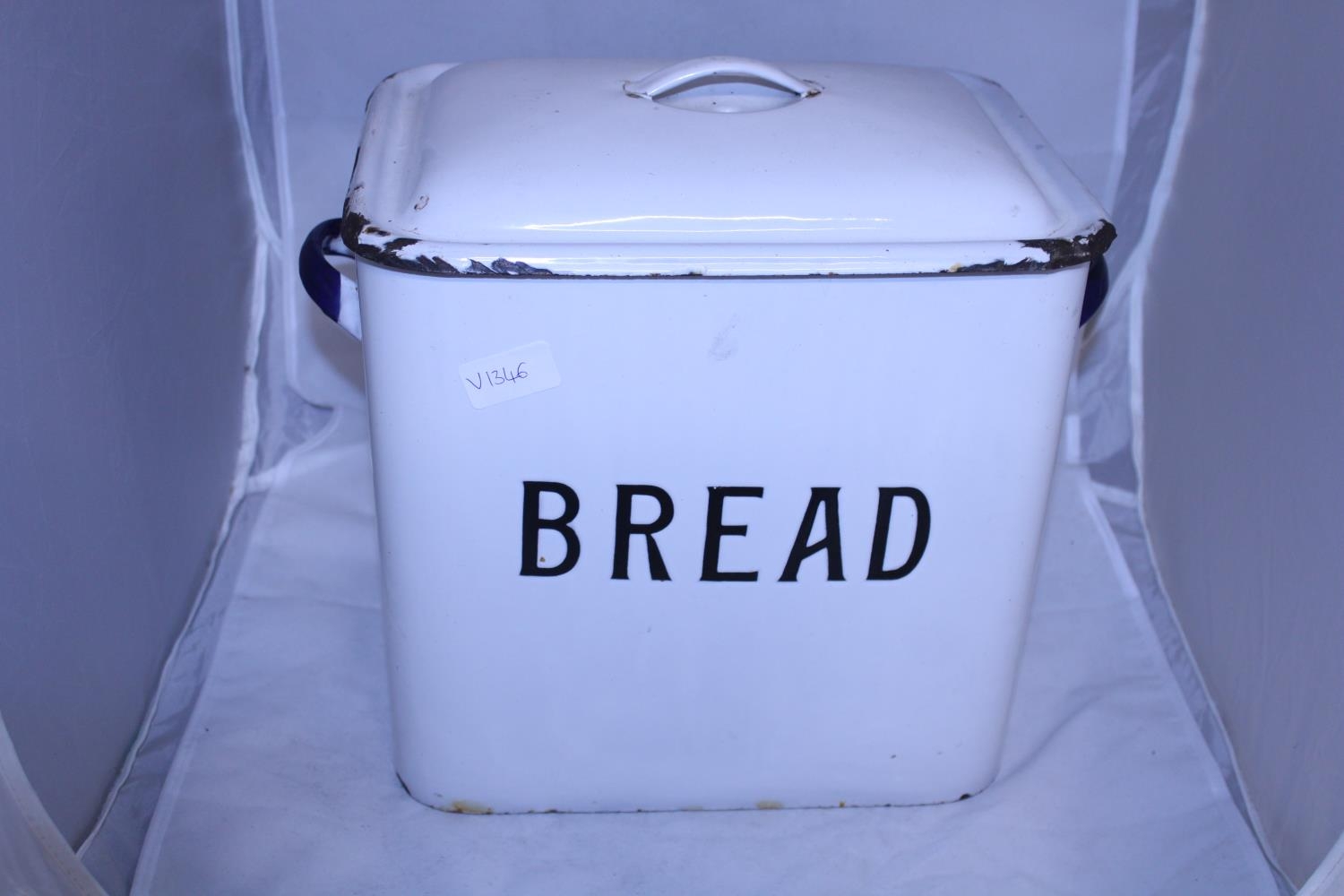 A large enamel bread bin