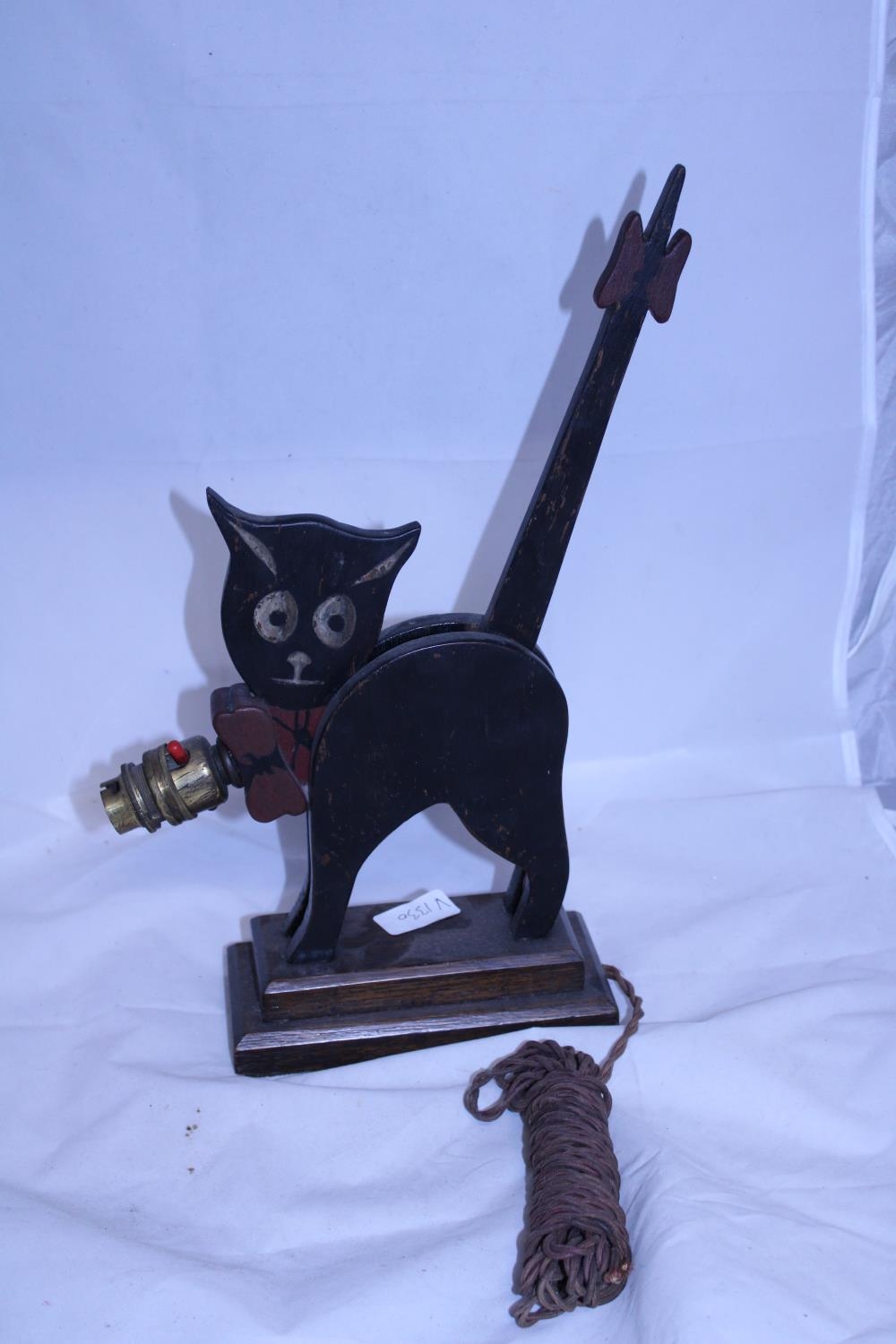 A vintage wooden cat themed lamp