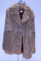 A ladies rabbit fur coat