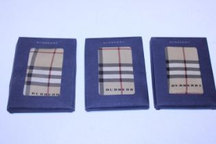 Three boxed Burberry silk scarves 45x45cm