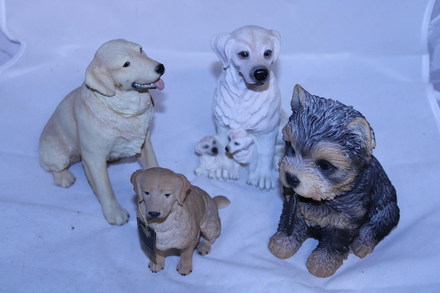 A assortment of collectable dog figurines