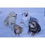A assortment of collectable dog figurines