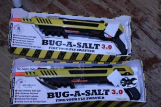 Two boxed Bug-a-Salt guns