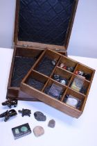 A wooden box and contents of semi precious stones etc
