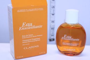 A boxed Clarins treatment fragrance