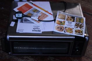 A lightly used Ninja foodie 8-1 mini oven