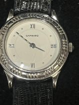 A ladies sterling silver cased Garrard One One Two quartz wrist watch in working order