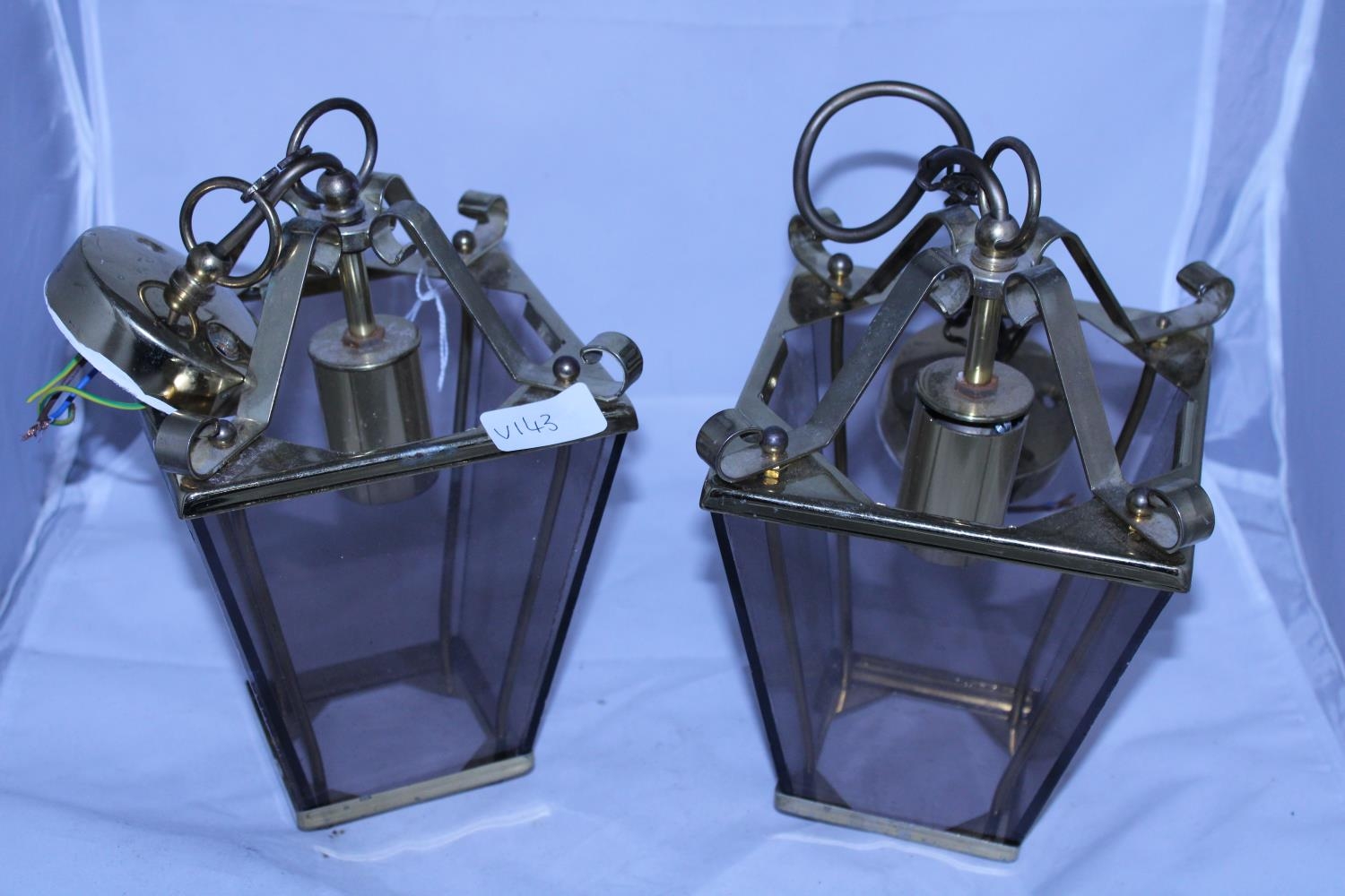 A pair of brass ceiling lanterns, shipping unavailable