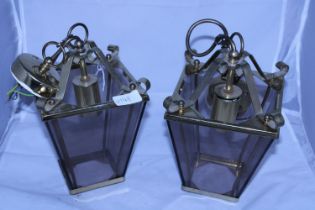 A pair of brass ceiling lanterns, shipping unavailable