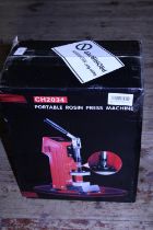 A boxed portable Rosin press machine