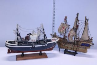 Two hand built wooden boat models. Shipping unavailable