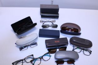 A box of designer prescription glasses and sunglasses