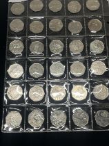 A selection of collectable 50p pieces including Beatrix potter, Paddington and Olympic