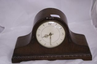 A wooden cased mantle clock (wind up movement), shipping unavailable