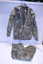 A wind proof military jacket and trousers size XL