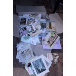 A box full of antique and vintage Christmas cards