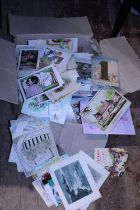 A box full of antique and vintage Christmas cards