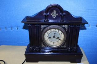 A wooden cased Edwardian mantle clock with key and pendulum, shipping unavailable