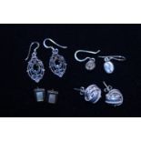 A selection of silver earrings