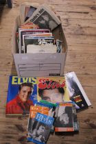 A box of Elvis Presley related books and ephemera