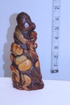 A hand carved horn figure