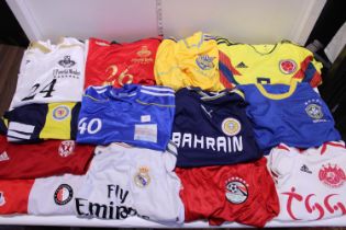 A box of assorted football shirts