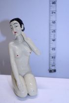 A nude form ceramic lady figure