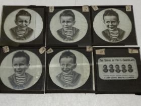 Five antique glass slides depicting the Five faces of the Fry's chocolate boy