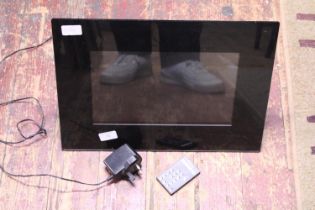A digital photo frame with remote 45x34cm