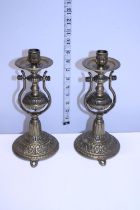 Two heavy brass wall mounted gimble candlestick holders