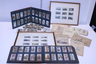 A job lot of assorted vintage cigarette card albums and loose card