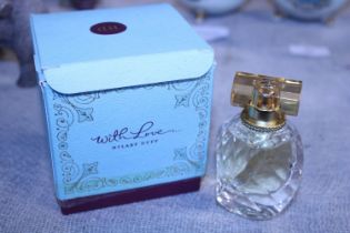 A boxed (slightly damaged) bottle of Hilary Duff perfume