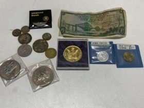 A small selection of collectable coins and bank note
