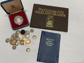 A selection of assorted silver coins and other commemorative coin