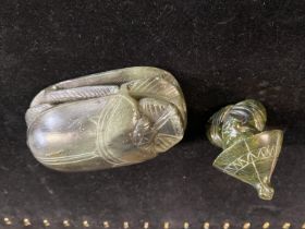 Two pieces of green carved soapstone