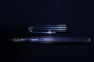 A vintage Thomas Lyte fountain pen with silver detailing