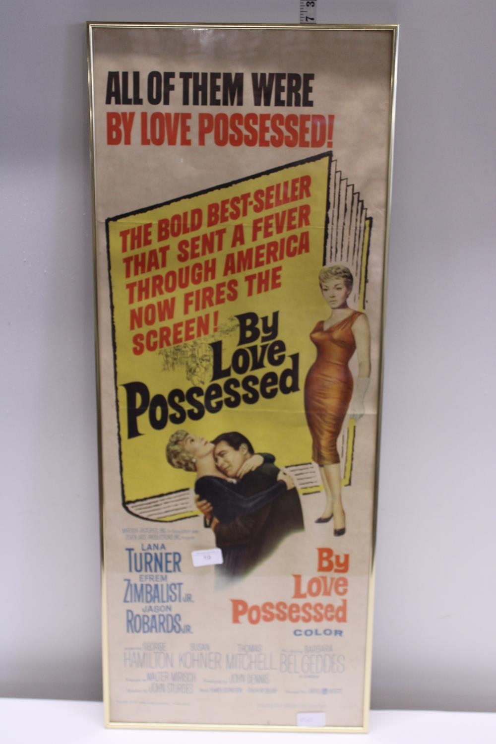 A vintage framed cinema poster from the 1960's 'By Love Possessed' 92x37cm, shipping unavailable