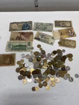 A selection of assorted world coins and notes
