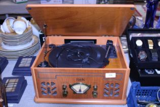 A vintage style Itek record and radio player. Shipping unavailable