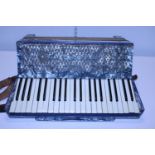 A vintage Hohner Verdi III accordion in case, shipping unavailable