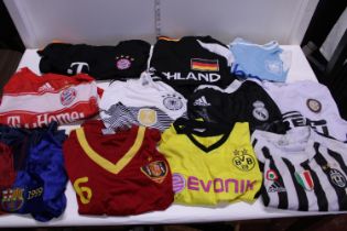 A box of assorted football shirts