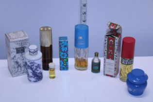 A selection of vintage cosmetic items and an empty Opaline de Lubin perfume bottle.