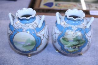 A pair of Noritake hand painted ovoid vases